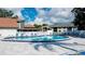 Relaxing kidney-shaped pool with lounge chairs at 4515 45Th W Ave # 201A, Bradenton, FL 34210