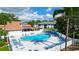 Community pool with lounge chairs and patio area at 4515 45Th W Ave # 201A, Bradenton, FL 34210