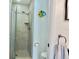 Walk-in shower with neutral tile and glass door at 4515 45Th W Ave # 201A, Bradenton, FL 34210