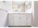 Bright bathroom featuring a double sink vanity with white cabinetry and stone countertops at 4739 Willow Bend Ave, Parrish, FL 34219