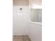 Bright bathroom featuring a pebble-tile shower floor and a white-tile shower surround at 4739 Willow Bend Ave, Parrish, FL 34219