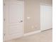 Bedroom featuring interior doors, a closet, base trim, and neutral carpet and walls at 4739 Willow Bend Ave, Parrish, FL 34219