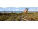 Lifeguard stand on beach with dune vegetation and ocean view at 504 Gulf St, Venice, FL 34285