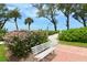 Landscaped beach access with seating and ocean view at 5055 Gulf Of Mexico Dr # 411, Longboat Key, FL 34228