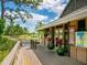Community clubhouse with welcoming porch and landscaping at 5244 Marsh Field Rd # 6, Sarasota, FL 34235