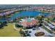 Aerial view of community clubhouse, pool, and lake at 5247 Esplanade Blvd, Bradenton, FL 34211