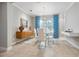 Elegant dining room with glass table and modern chandelier at 5247 Esplanade Blvd, Bradenton, FL 34211