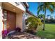 Inviting front entrance featuring a decorative door, lush landscaping, and a paver walkway at 5814 Cavano Dr, Sarasota, FL 34231