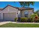 Charming single-Gathering home featuring a neutral color palette, paver driveway, and well-maintained landscaping at 5814 Cavano Dr, Sarasota, FL 34231