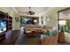 Comfortable living room with wood floors, a tray ceiling, and a ceiling fan at 5814 Cavano Dr, Sarasota, FL 34231