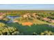 Enjoy community living with a lake and ball field in this gorgeous aerial view at 611 Dogwood Run, Bradenton, FL 34212