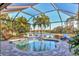 Screened-in pool overlooking a beautiful lake provides a private oasis for relaxation and enjoyment at 611 Dogwood Run, Bradenton, FL 34212