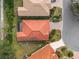 Aerial view of the house showcasing the roof, driveway, and surrounding landscaping at 6211 Skyward Ct, Bradenton, FL 34203