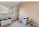 Bright bedroom featuring a desk, window, and a side cabinet at 6211 Skyward Ct, Bradenton, FL 34203