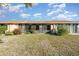 The backyard features a well-maintained lawn and a covered porch at 6314 29Th W Ave, Bradenton, FL 34209