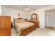 Serene bedroom featuring a wooden bed frame, soft lighting, and a calming atmosphere for restful nights at 6314 29Th W Ave, Bradenton, FL 34209