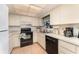 Functional kitchen with white cabinets, standard appliances, and a bright, practical layout at 6314 29Th W Ave, Bradenton, FL 34209