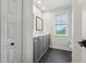 Clean bathroom with double vanity and dark gray cabinets at 6330 Laguna Dr, Longboat Key, FL 34228