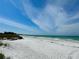 Expansive beach with white sand, blue water and clear sky at 6330 Laguna Dr, Longboat Key, FL 34228