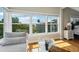 Bright sitting area off main bedroom with window seat and water views at 6330 Laguna Dr, Longboat Key, FL 34228