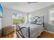 Bright bedroom with a comfortable bed and large window at 6330 Laguna Dr, Longboat Key, FL 34228