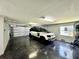 Garage with Land Rover, extra storage and epoxy flooring at 6330 Laguna Dr, Longboat Key, FL 34228