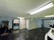 Spacious garage with ample storage, game area and large refrigerator at 6330 Laguna Dr, Longboat Key, FL 34228