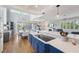Modern kitchen with blue cabinetry, quartz countertops, and high-end appliances at 6330 Laguna Dr, Longboat Key, FL 34228