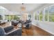 Relaxing living room with hardwood floors, comfortable seating, and a view to the kitchen at 6330 Laguna Dr, Longboat Key, FL 34228