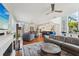 Open floor plan with hardwood floors, fireplace, and spacious seating at 6330 Laguna Dr, Longboat Key, FL 34228