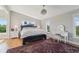 Large main bedroom with comfy bed and elegant hardwood floors at 6330 Laguna Dr, Longboat Key, FL 34228