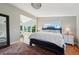 Spacious main bedroom with plush bedding and hardwood floors at 6330 Laguna Dr, Longboat Key, FL 34228