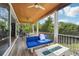 Spacious screened porch with fire pit and seating at 6330 Laguna Dr, Longboat Key, FL 34228