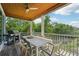 Covered porch with grill and outdoor dining at 6330 Laguna Dr, Longboat Key, FL 34228