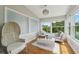 Light-filled sitting area boasts a comfy couch and natural light at 6330 Laguna Dr, Longboat Key, FL 34228