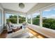 Bright sunroom with ample natural light and seating at 6330 Laguna Dr, Longboat Key, FL 34228