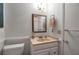 Clean bathroom with a vanity, toilet, and a mirrored medicine cabinet at 6430 Sun Eagle Ln # 201, Bradenton, FL 34210