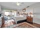Main bedroom with king bed and balcony access at 6430 Sun Eagle Ln # 201, Bradenton, FL 34210