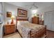 Bright bedroom with a floral patterned bed and wooden furniture at 6430 Sun Eagle Ln # 201, Bradenton, FL 34210