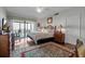 Main bedroom with water view and hardwood floors at 6430 Sun Eagle Ln # 201, Bradenton, FL 34210