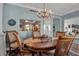 Elegant dining room features a wood table and chandelier, perfect for gatherings at 6430 Sun Eagle Ln # 201, Bradenton, FL 34210