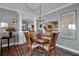Elegant dining room with chandelier and hardwood floors at 6430 Sun Eagle Ln # 201, Bradenton, FL 34210