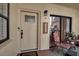 Front door with welcoming mat and sidelights at 6430 Sun Eagle Ln # 201, Bradenton, FL 34210