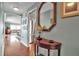 Hallway with hardwood floors and gallery wall at 6430 Sun Eagle Ln # 201, Bradenton, FL 34210