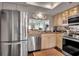 Modern kitchen with stainless steel appliances and granite counters at 6430 Sun Eagle Ln # 201, Bradenton, FL 34210