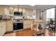 Updated kitchen with stainless steel appliances and island at 6430 Sun Eagle Ln # 201, Bradenton, FL 34210