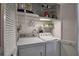 Convenient laundry closet with washer, dryer, and storage at 6430 Sun Eagle Ln # 201, Bradenton, FL 34210
