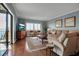 Bright living room with hardwood floors, water views, and comfortable seating at 6430 Sun Eagle Ln # 201, Bradenton, FL 34210