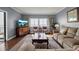 Bright living room with hardwood floors, water views, and comfortable seating at 6430 Sun Eagle Ln # 201, Bradenton, FL 34210