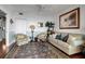 Spacious living room with hardwood floors, comfortable seating and water views at 6430 Sun Eagle Ln # 201, Bradenton, FL 34210